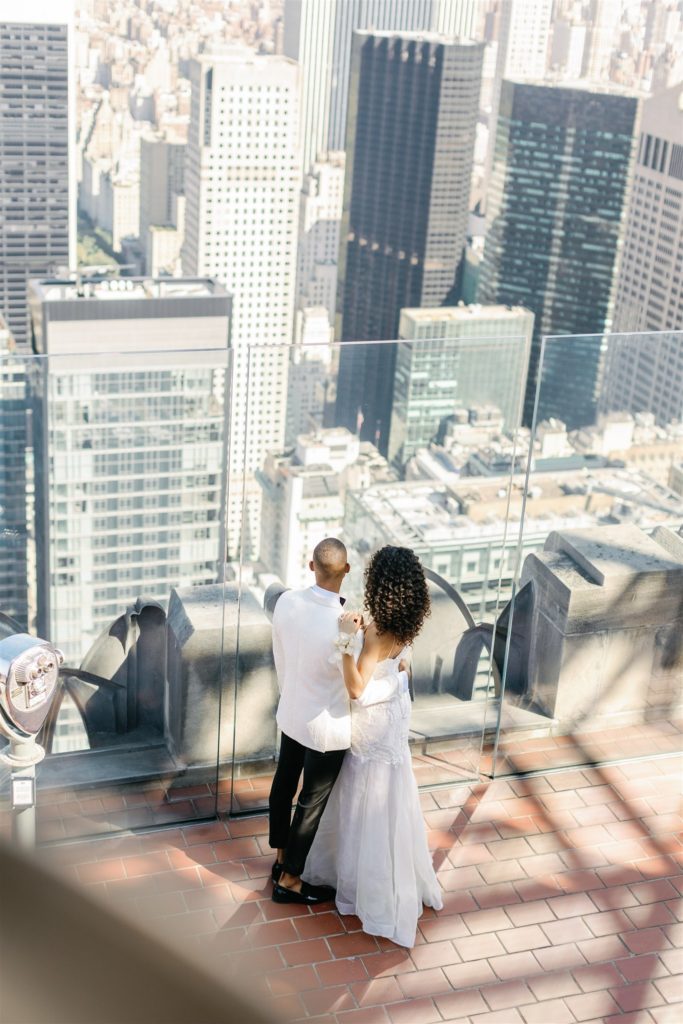 Black couple wedding portrait on top of the rock in new york city