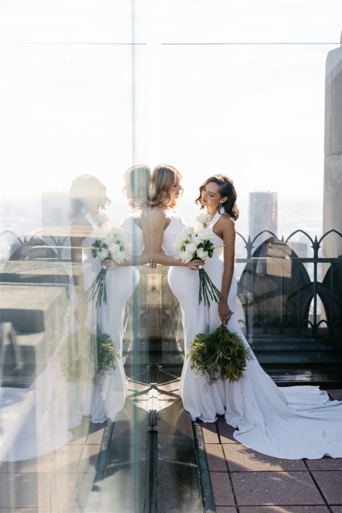 gay wedding portrait on top of the rock in new york city